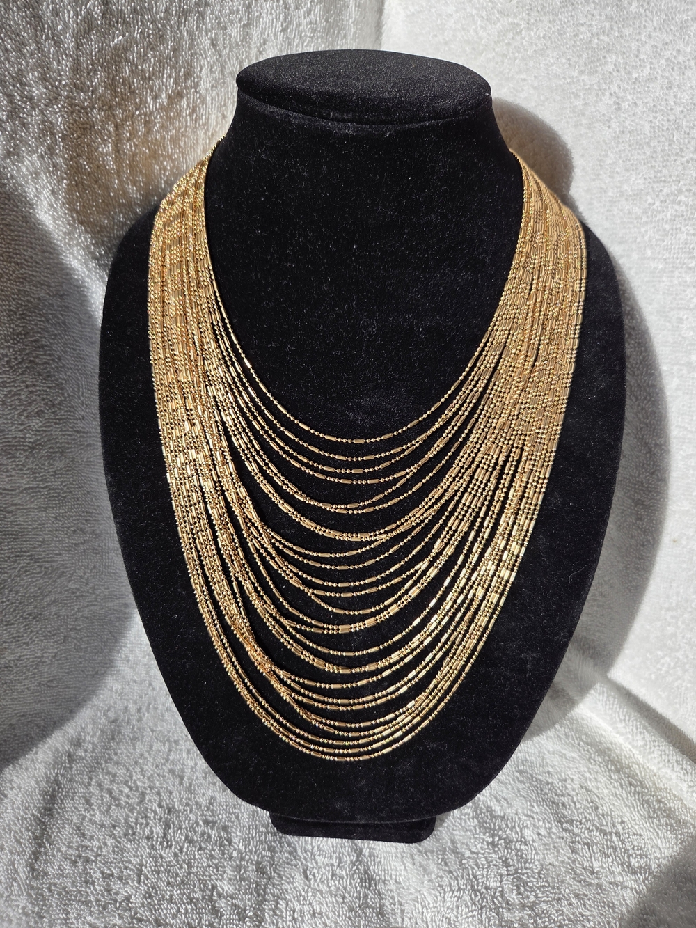 Multi-Row Waterfall Bib Necklace in Gold Tone